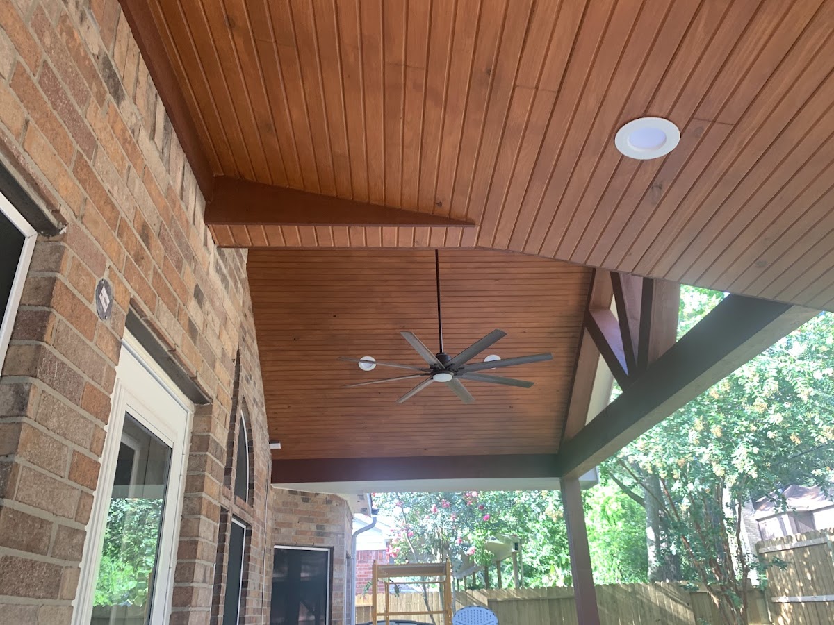 Stained tongue-and-groove patio ceiling finished by Meraz